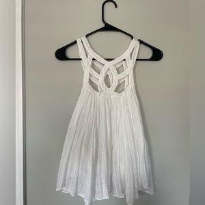 Free People white flowy tank top. Unique detailing on the neckline. Size Small